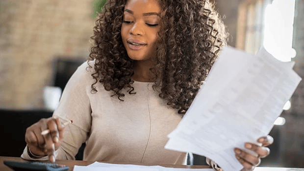 African women with calculater and papers 
